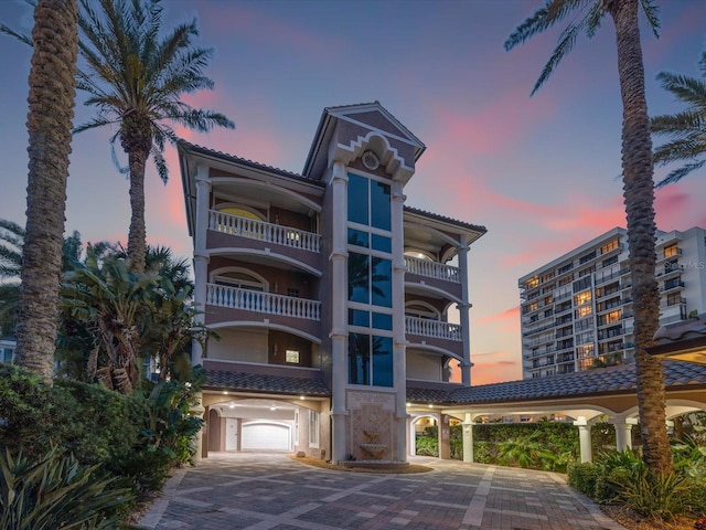 view of outdoor building at dusk