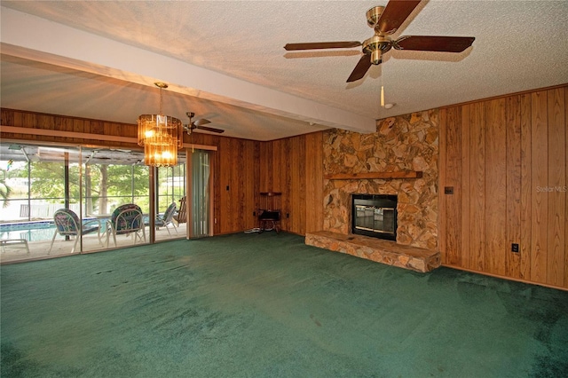 unfurnished living room featuring beam ceiling, wooden walls, and dark colored carpet