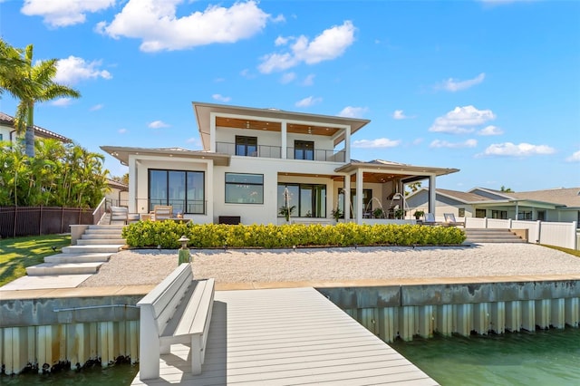 back of property featuring a balcony