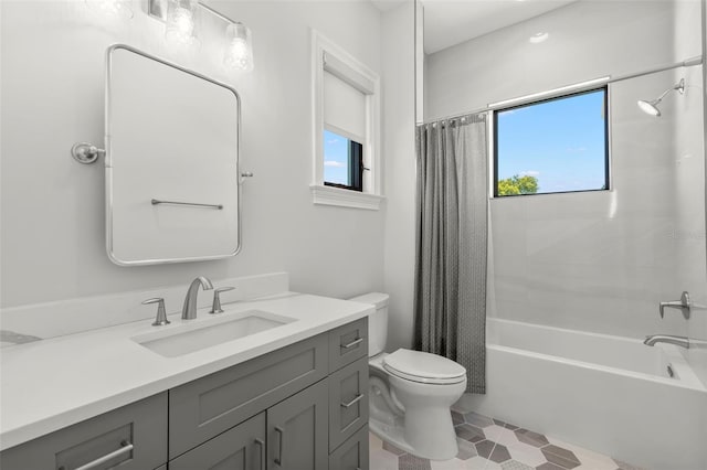 full bathroom featuring tile patterned floors, toilet, vanity, and shower / bathtub combination with curtain