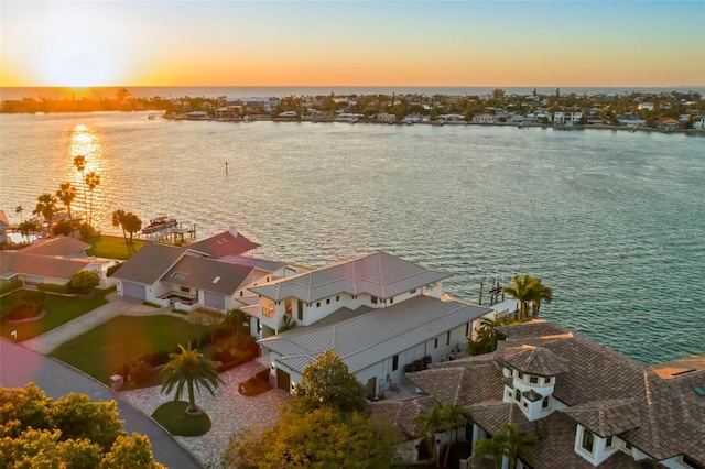 aerial view at dusk with a water view