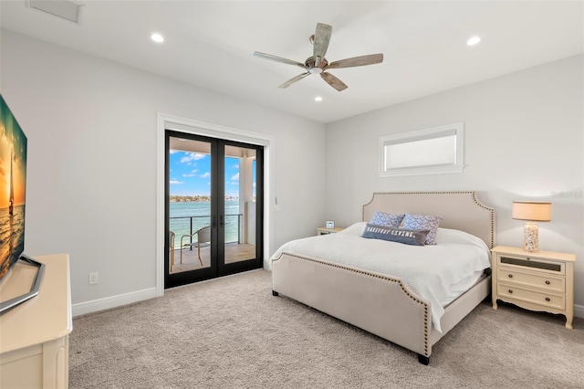 carpeted bedroom featuring ceiling fan, a water view, french doors, and access to outside