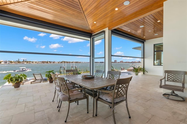 view of patio with a water view