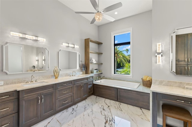 bathroom featuring ceiling fan, vanity, and a bathing tub