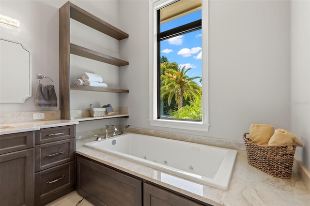 bathroom with vanity and a bathing tub