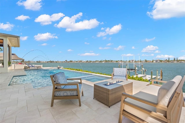 view of patio / terrace featuring a fire pit, a dock, a water view, and a swimming pool with hot tub