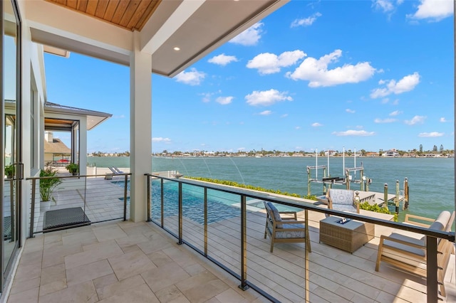 balcony featuring a water view