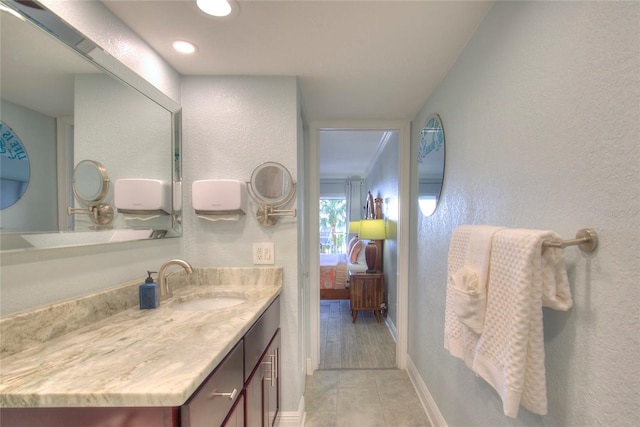 bathroom featuring tile patterned flooring and vanity