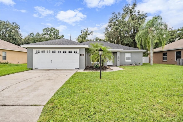 ranch-style home with a front lawn, central air condition unit, concrete driveway, stucco siding, and a garage