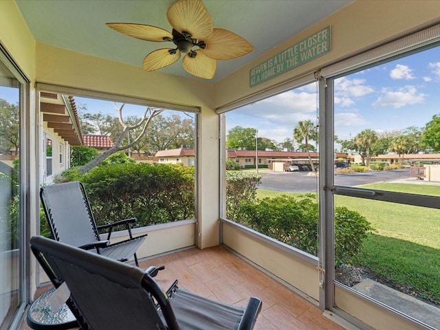 sunroom / solarium with ceiling fan