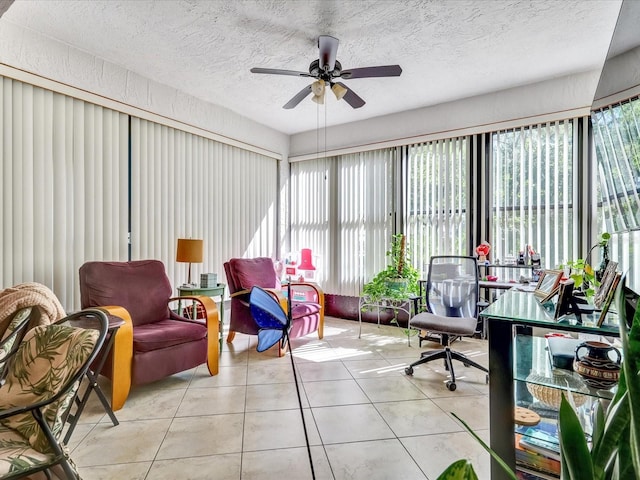 sunroom featuring ceiling fan