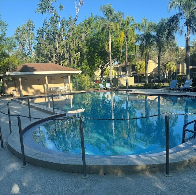 view of swimming pool featuring a patio area