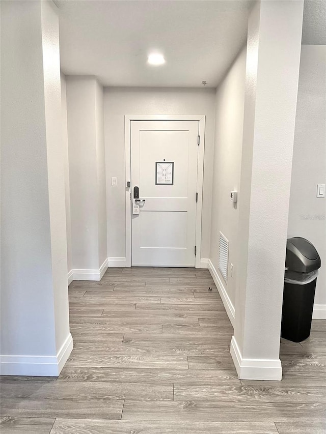 doorway to outside with light hardwood / wood-style flooring