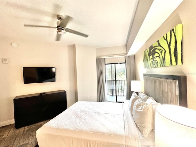 bedroom featuring hardwood / wood-style floors, ceiling fan, a textured ceiling, and access to outside