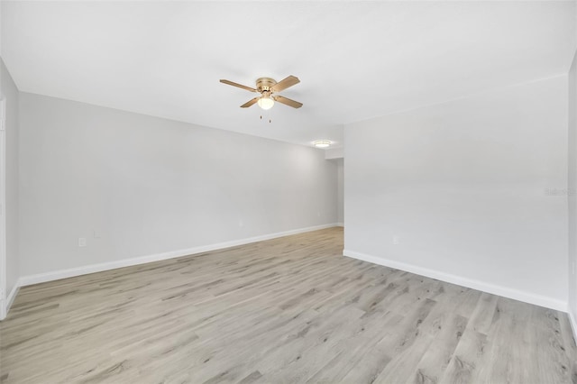 unfurnished room featuring light wood-type flooring and ceiling fan