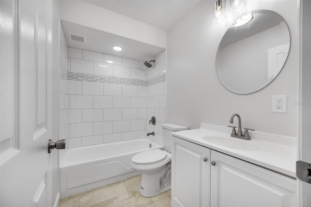 full bathroom featuring toilet, tile patterned flooring, tiled shower / bath combo, and vanity