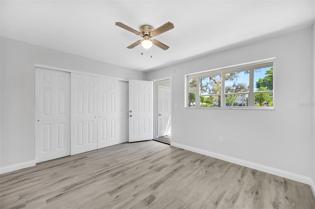 unfurnished bedroom featuring ceiling fan and light hardwood / wood-style floors