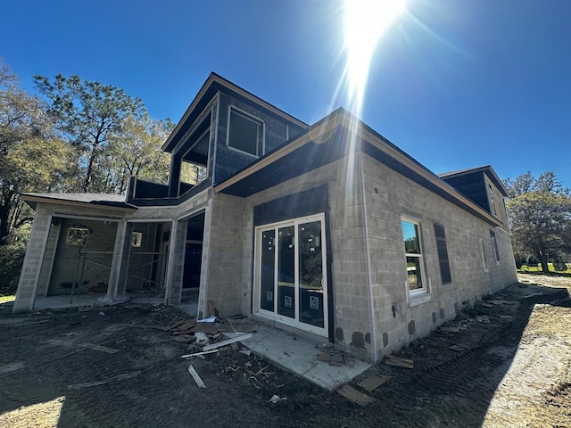 exterior space with concrete block siding