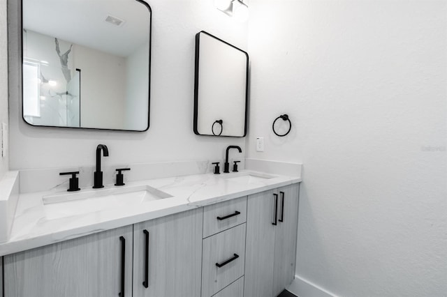 bathroom with dual vanity