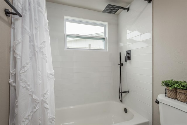 bathroom with shower / bath combo and toilet