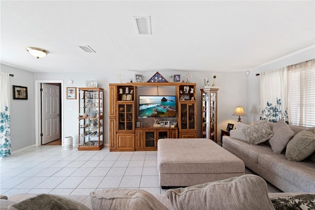 living room featuring light tile flooring