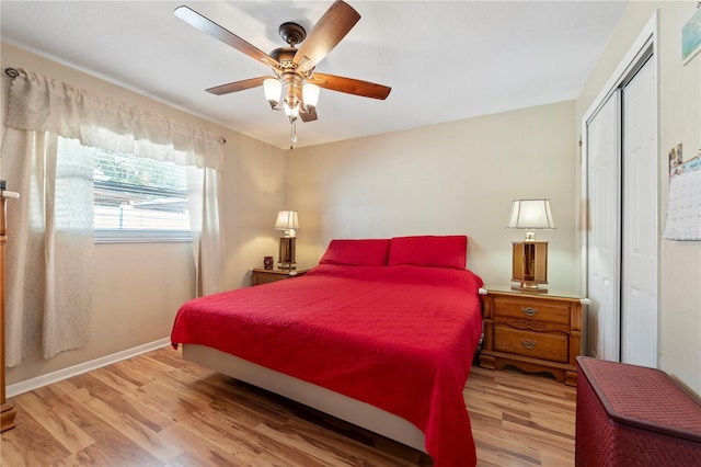 bedroom with light hardwood / wood-style floors, a closet, and ceiling fan