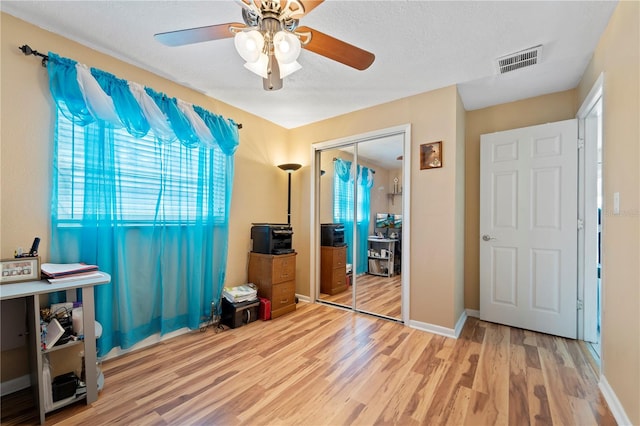 interior space featuring light hardwood / wood-style flooring and ceiling fan