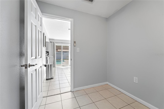 empty room with light tile floors