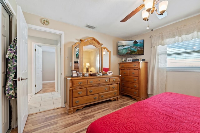 bedroom featuring ceiling fan and light hardwood / wood-style flooring