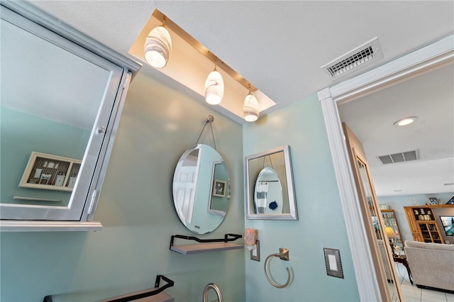 interior details featuring light tile flooring