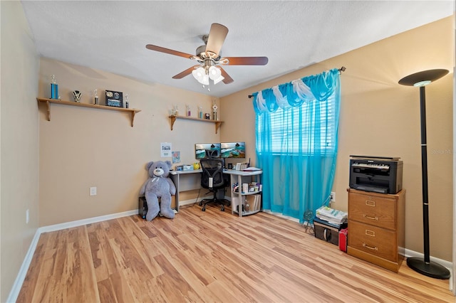 office area with ceiling fan and light wood-type flooring