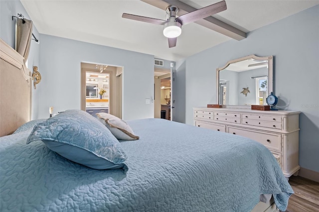 bedroom with ceiling fan, beamed ceiling, and light hardwood / wood-style floors