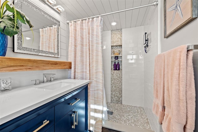 bathroom with vanity and curtained shower