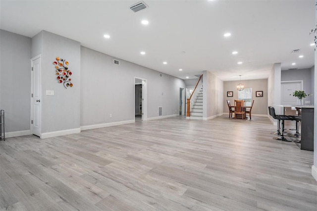 unfurnished living room featuring light hardwood / wood-style flooring