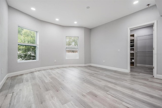 unfurnished room featuring light hardwood / wood-style floors