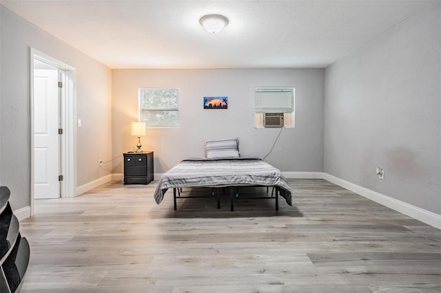 bedroom with light hardwood / wood-style flooring