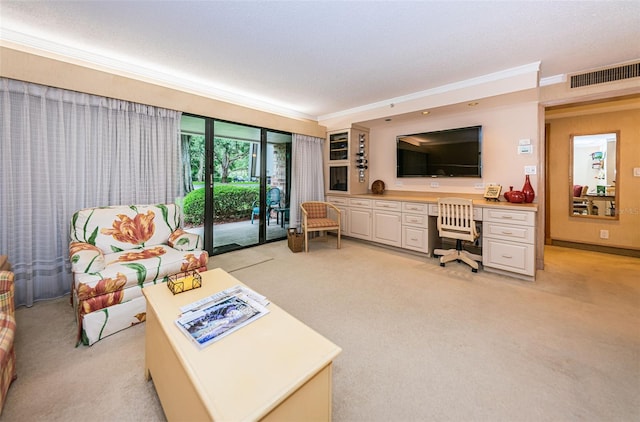 carpeted living room featuring a textured ceiling and ornamental molding