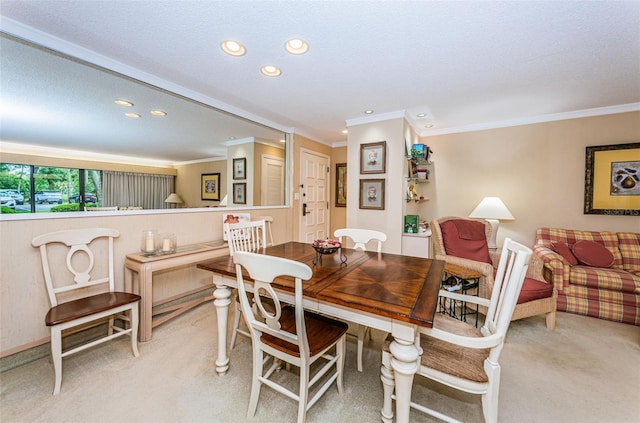 dining room featuring crown molding, light carpet, and a textured ceiling