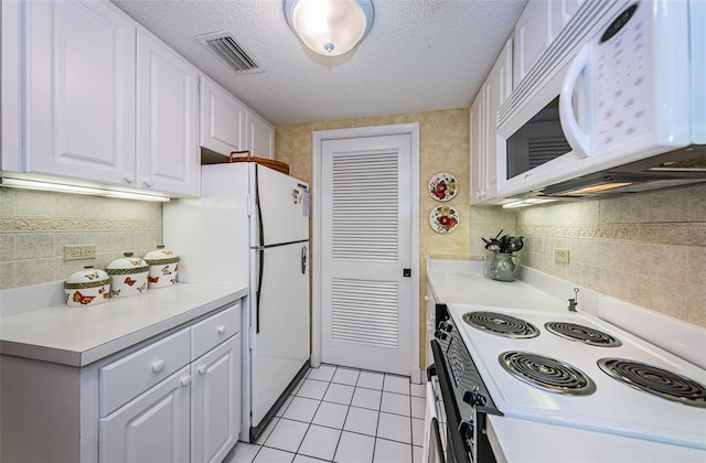 kitchen featuring light tile floors, a textured ceiling, white appliances, white cabinetry, and backsplash