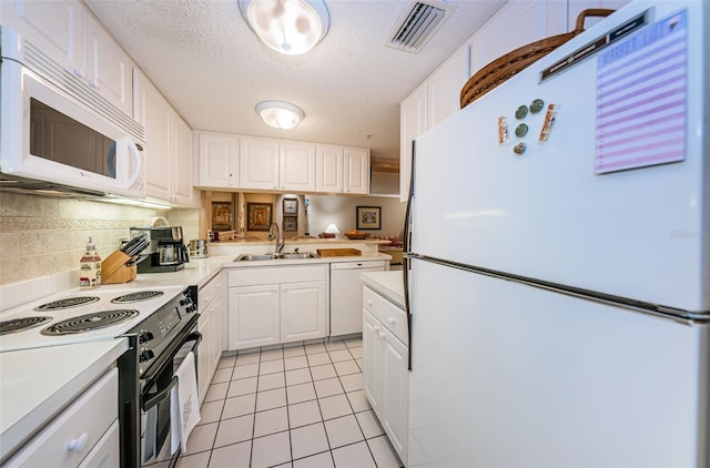 kitchen featuring white cabinetry, white appliances, sink, and light tile floors