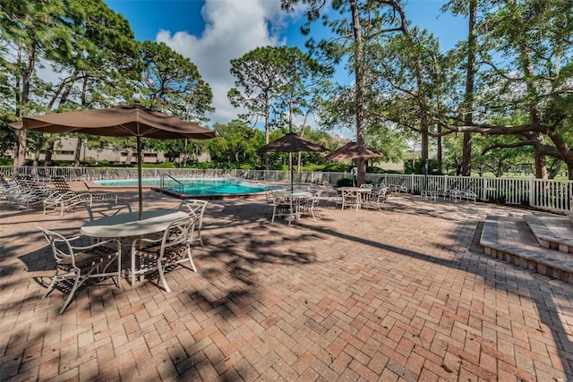 view of patio with a community pool