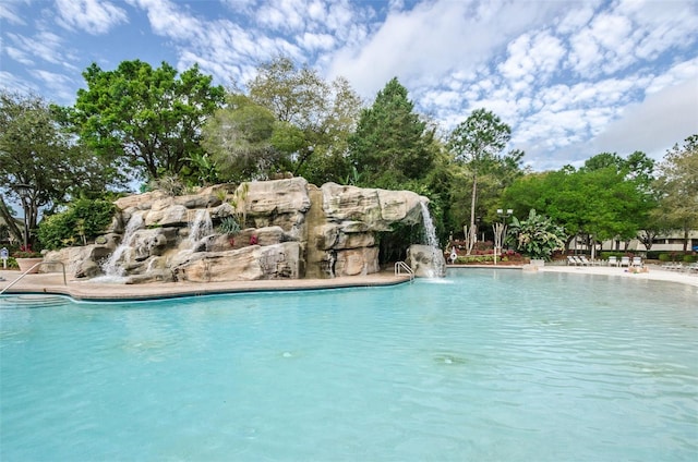 view of pool featuring pool water feature