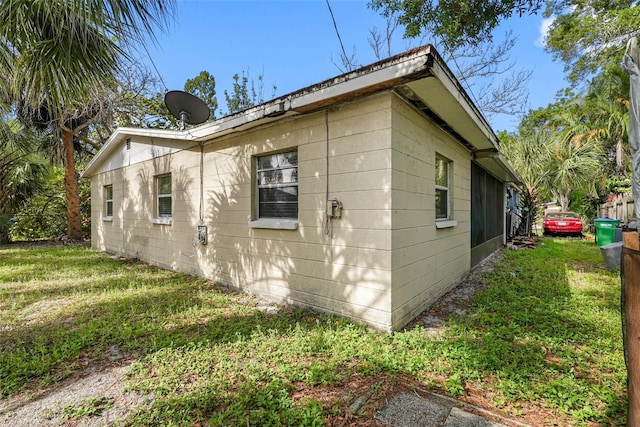 view of property exterior featuring a lawn