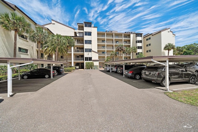 view of parking / parking lot featuring a carport