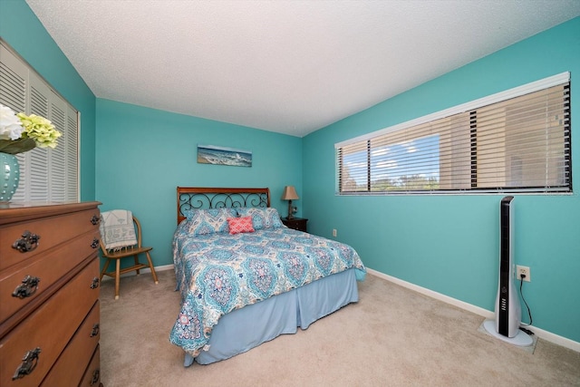 carpeted bedroom with a textured ceiling