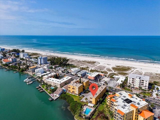 birds eye view of property featuring a water view and a view of the beach