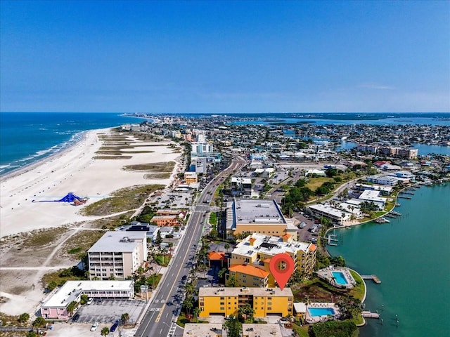 bird's eye view with a water view and a beach view