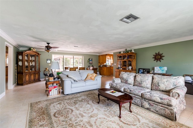 tiled living room featuring crown molding and ceiling fan