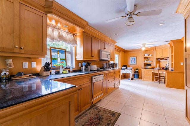 kitchen with ceiling fan, white appliances, light tile flooring, and a healthy amount of sunlight