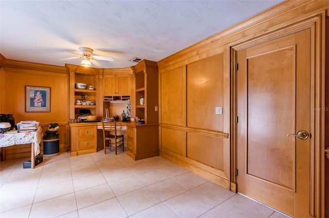 office space with ceiling fan and light tile floors